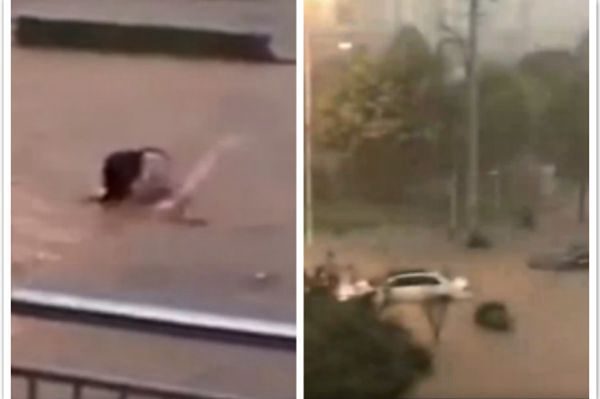 南京暴雨，一对夫妻被淹在水中